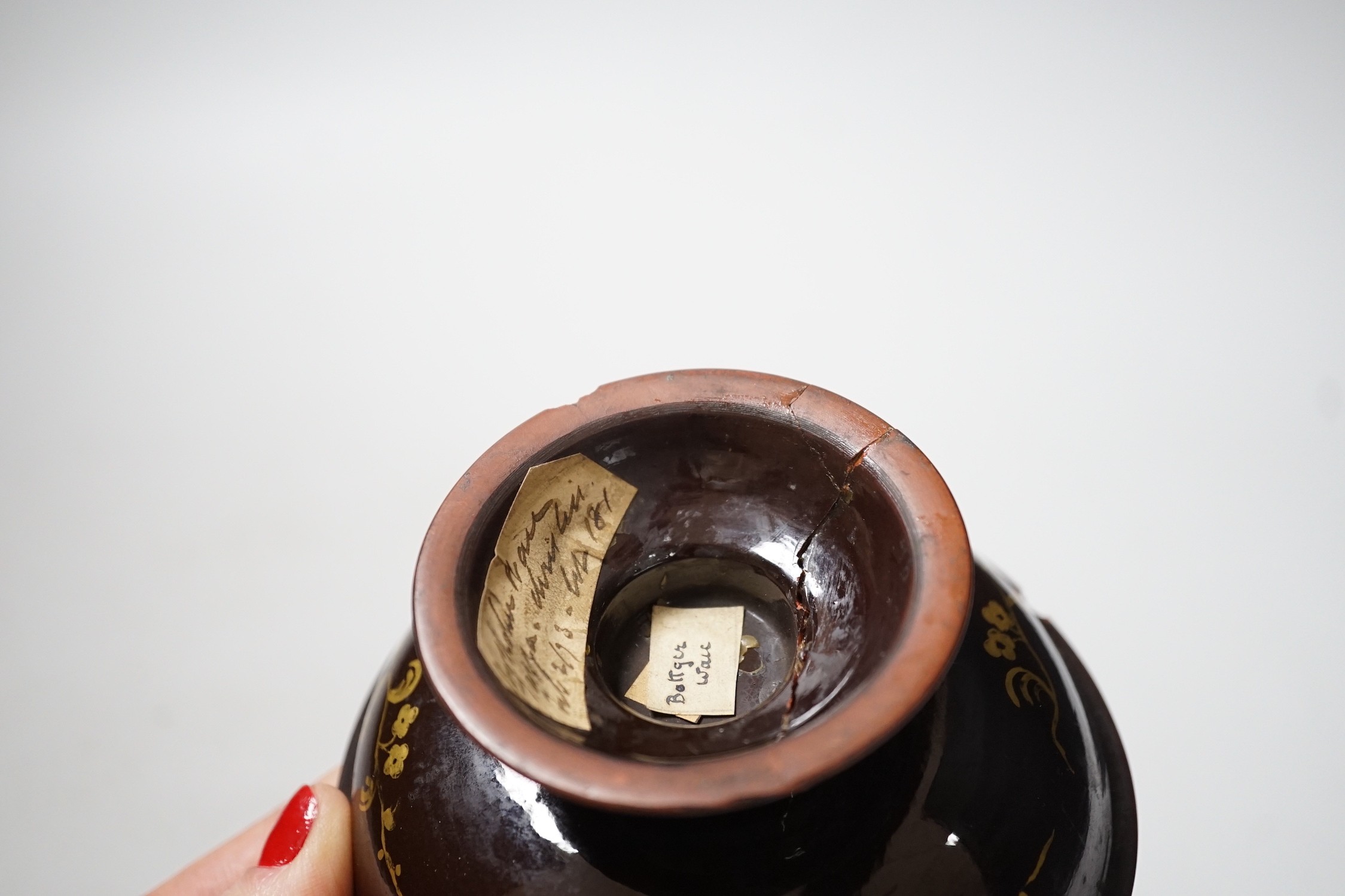 A Bayreuth glazed and gilded footed dish, c.1730-40, in imitation of Böttger stoneware, 11.2cm diameter, foot glued